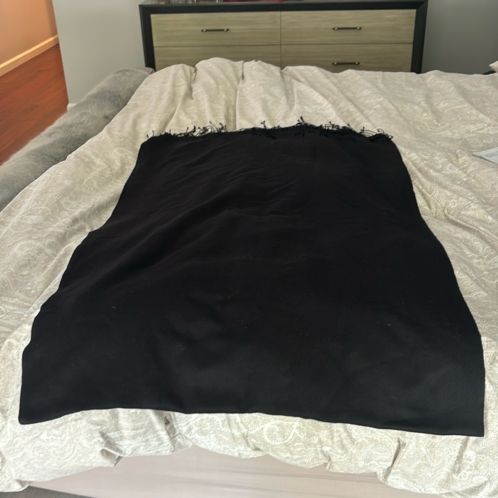 Black Pashmina with edge fringes 80” length x27” width. 70% wool 30% silk